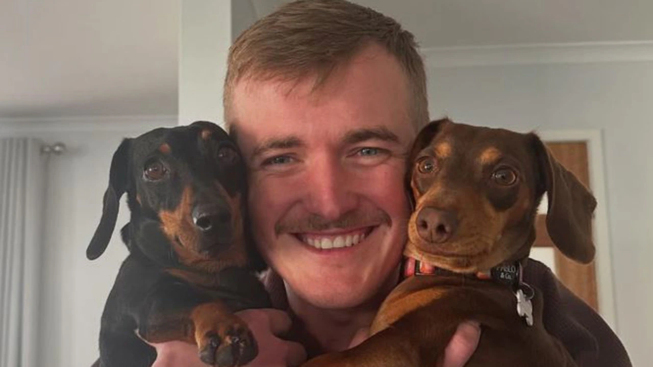 Happy family enjoying time with their dachshund
